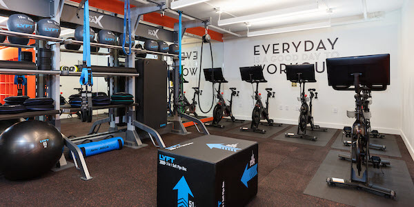 Fitness center with bikes and HIIT equipment.