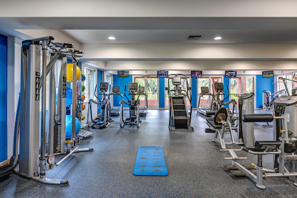 Fitness center with cardio and strength training equipment.