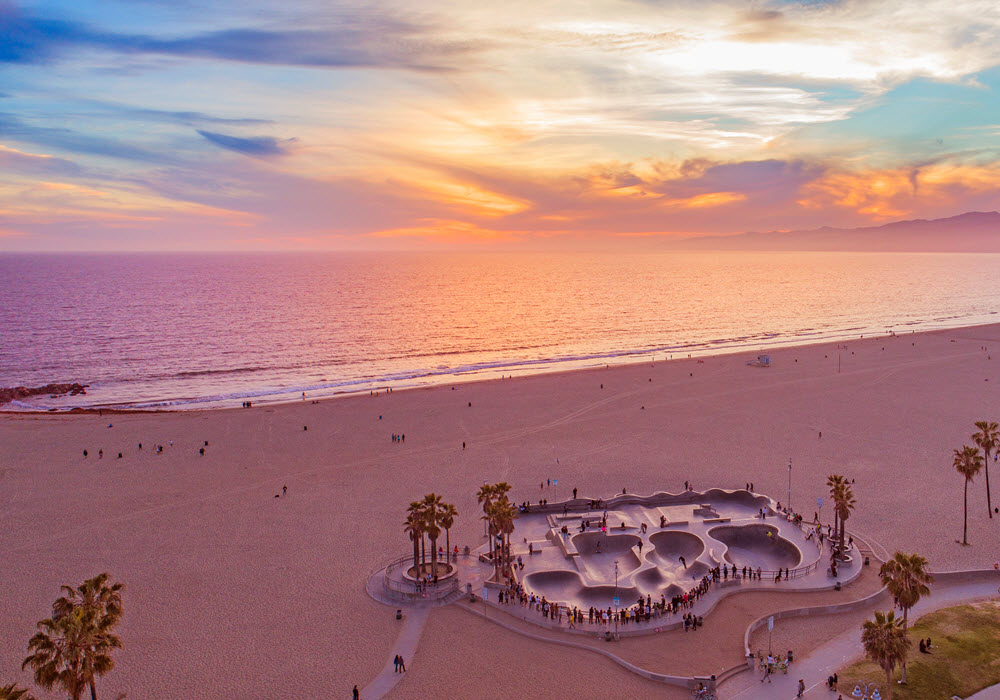 Venice Beach at sunset with view of ocean and skate park. 