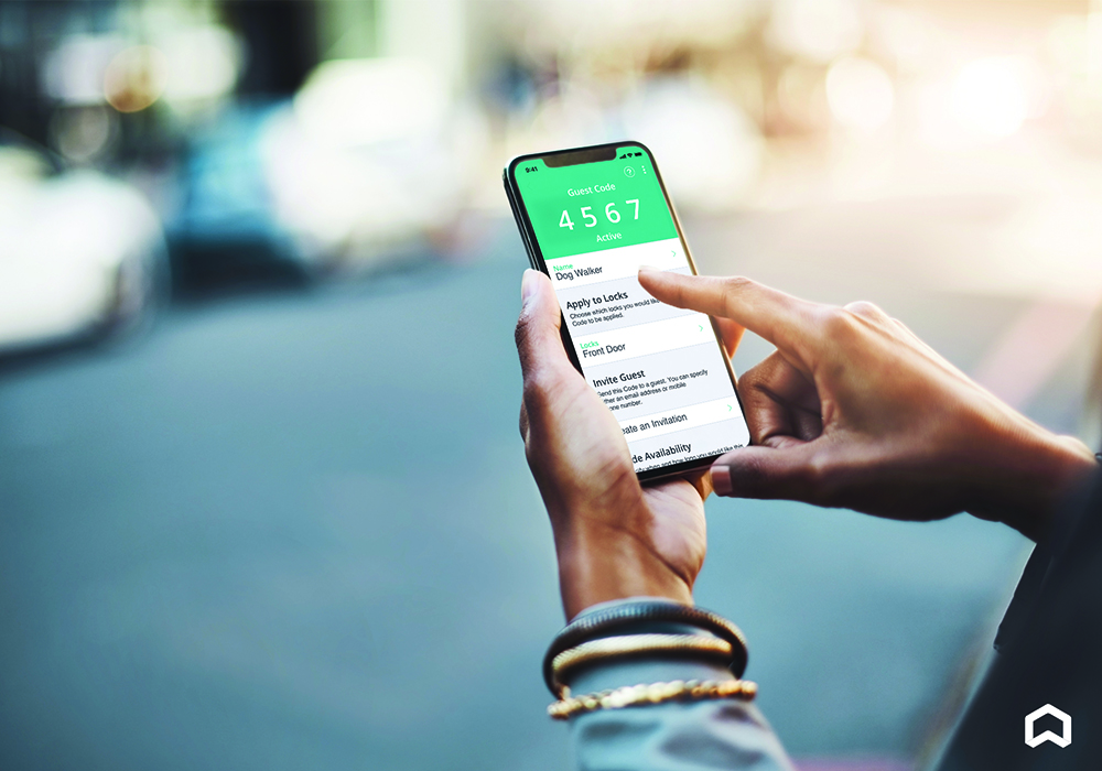 Person using smart home technology on their phone to allow entry for a dog walker