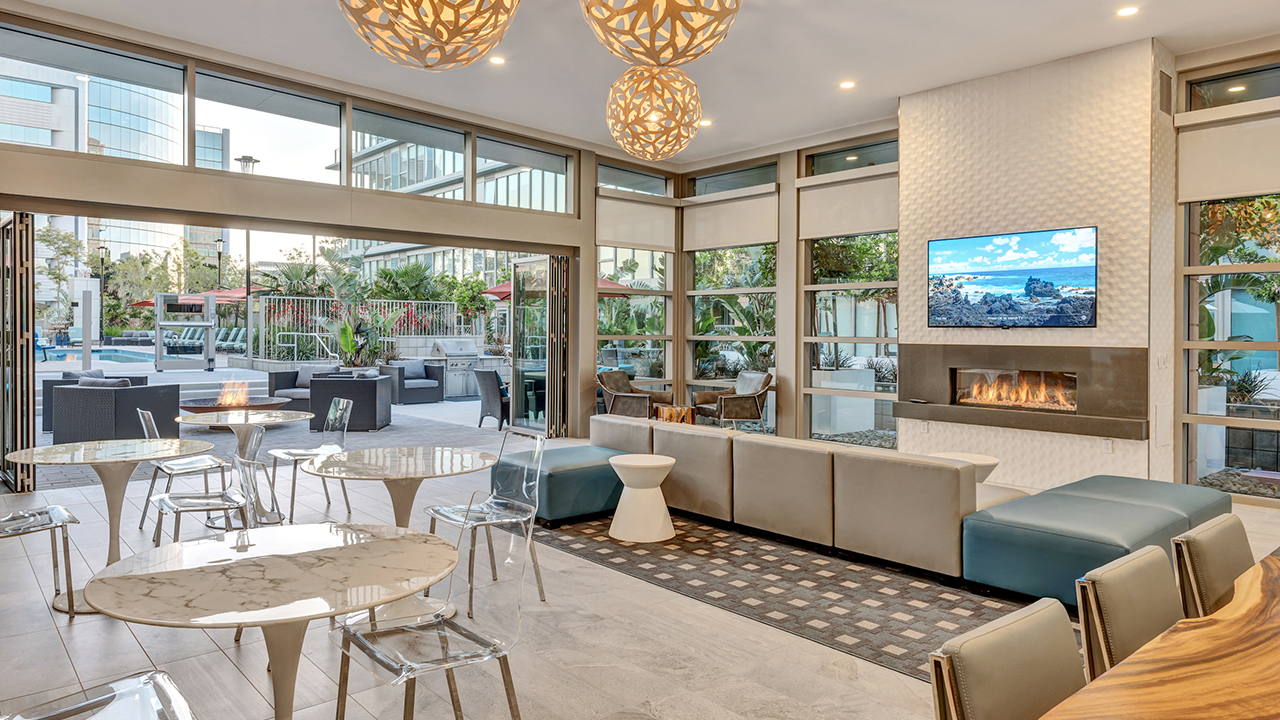 Lavish Lounge with sofas, chairs, table, TV, and fireplace