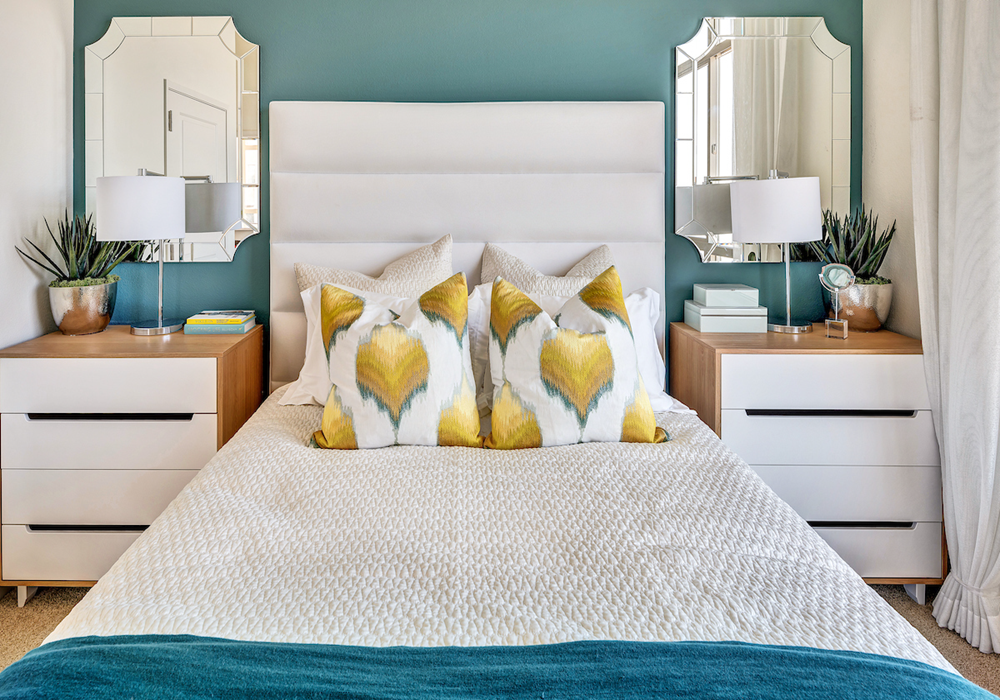 Front view of staged bed in an apartment home.