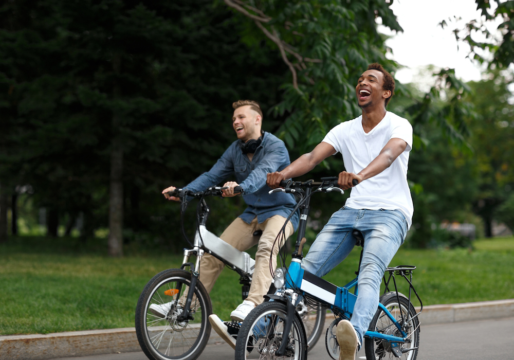 Two men riding bicycles at a park on Car Free Day