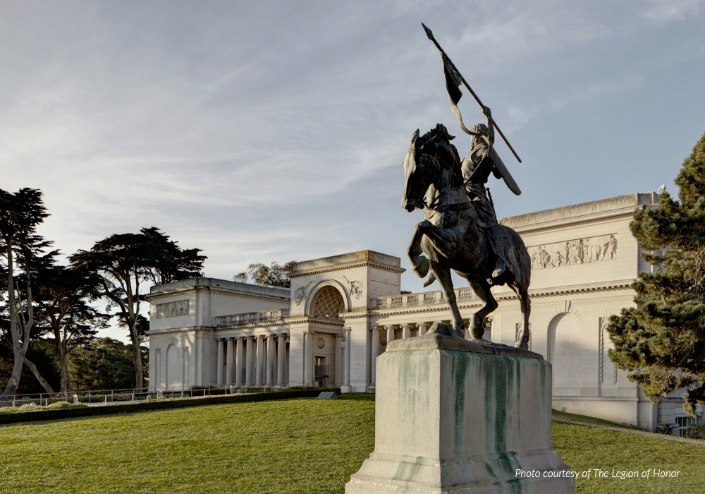 Statue of a man on horse holding flag in San Francisco.