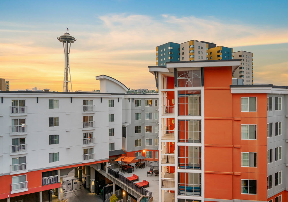 Exterior view of Fountain Court Apartments in Seattle at sunrise.