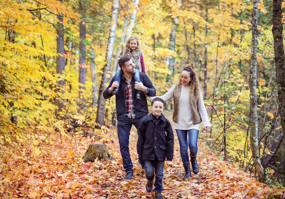 Family of four hiking in the Fall.