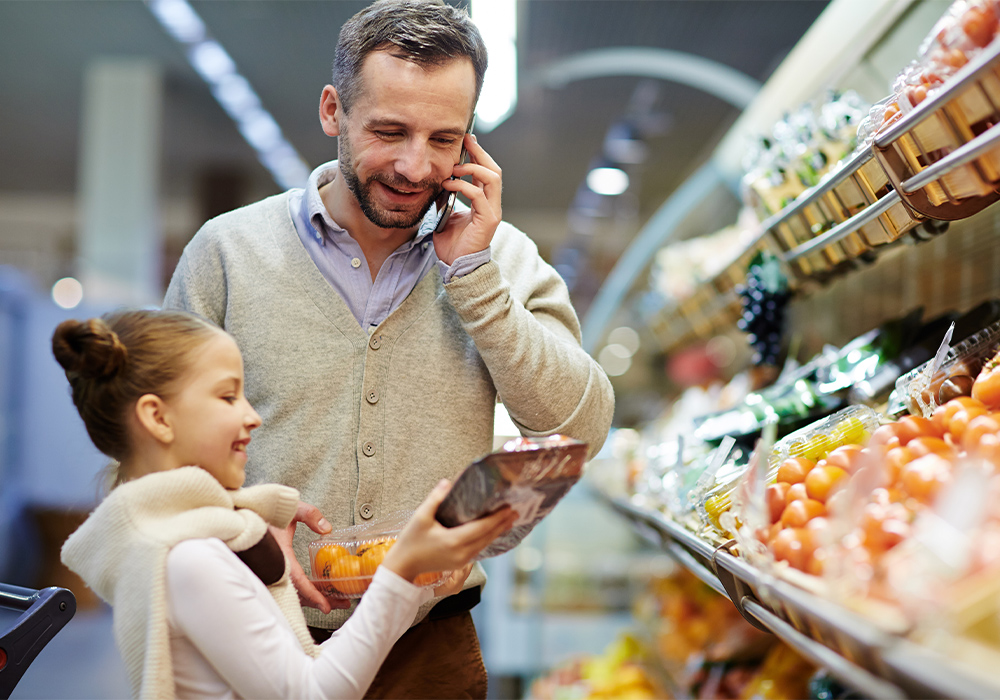 Father and daughter shopping in produce