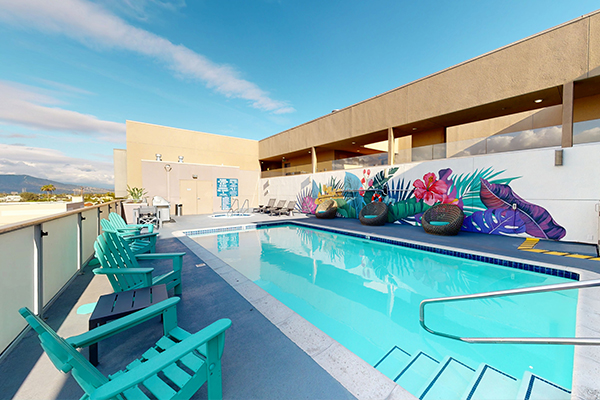 Rooftop spa and swimming pool area with lounge seating.