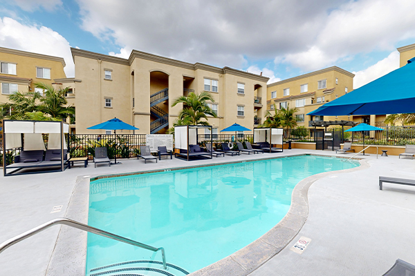 Outdoor swimming pool area with lounge seating.