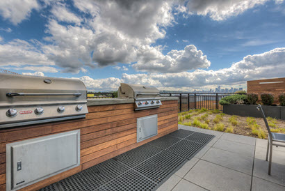 BBQ area with two BBQs.